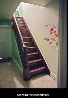 a staircase with stairs to the second floor of a house at Private Room - Shared Bathroom in Perth Amboy