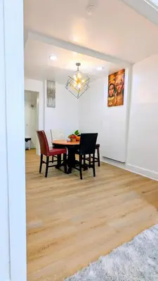 a dining room with a table and chairs at 3bedroom 2 bath minutes away from Temple, Philly museum, Philly zoo , center city in Philadelphia