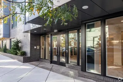 a store front with glass windows and a building at Stylish Studio - Pool, Gym & Balcony Bliss in Philadelphia