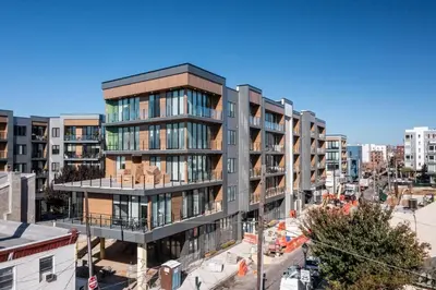 an apartment building in a city with buildings at Stylish Studio - Pool, Gym & Balcony Bliss in Philadelphia