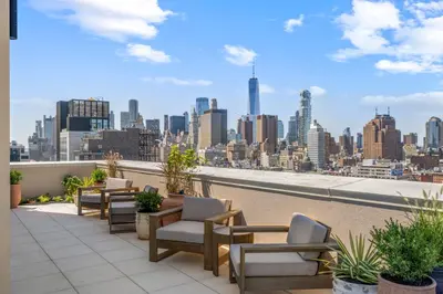 a balcony with chairs and a view of the city at Freeman 601 by Rove Studio with Shared Amenities in New York