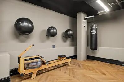 a boxing gym with a punching bag on the wall at Freeman 1101 by Rove Travel - Studio with Shared Amenities in New York