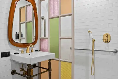 a bathroom with a sink and a mirror at Freeman 503 by Rove Travel - 1BR Condo with Shared Amenities in New York