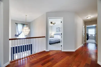 a hallway with a bedroom and a living room at Poconos Retreat Hot Tub, Pool, Theater EV chrg & more in Blakeslee