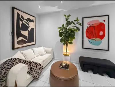 a living room with a couch and a table at Superb 4-bedroom apartment 1 block from Central Park in vibrant New York City in New York