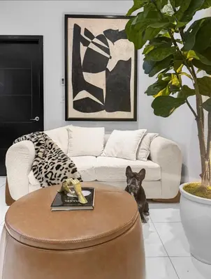 a living room with a dog sitting next to a coffee table at Superb 4-bedroom apartment 1 block from Central Park in vibrant New York City in New York