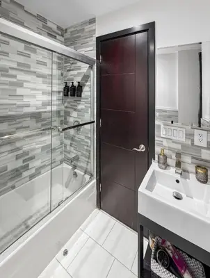 a bathroom with a shower and a sink at Superb 4-bedroom apartment 1 block from Central Park in vibrant New York City in New York