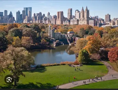 a view of a park with a city in the background at Superb 4-bedroom apartment 1 block from Central Park in vibrant New York City in New York
