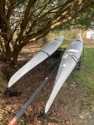three kayaks sitting on the grass under a tree at Historic Canal Home on Nature Preserve in Princeton