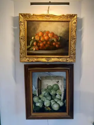 two paintings of fruit are on a wall at Historic Canal Home on Nature Preserve in Princeton