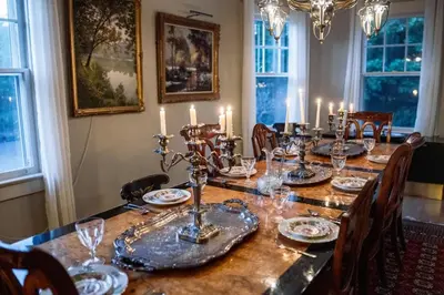 a dining room table with candles on top of it at Private Luxurious Canal Estate in Princeton