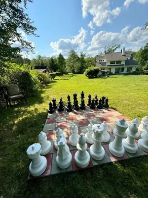 a chess set on a table in a yard at Private Luxurious Canal Estate in Princeton