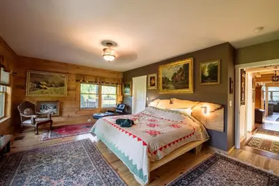 a bedroom with a large bed in a room at Private Luxury Log Cabin in New Hope