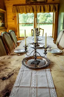 a long table with candles on top of it at Private Luxury Log Cabin in New Hope