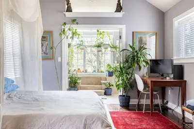 a bedroom with a bed and a desk with a computer at Unique Luxury Central Historic Landmark Home in Lambertville