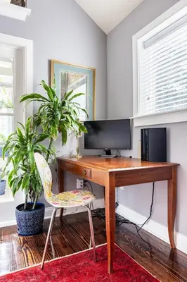 a desk with a computer and a chair in a room at Unique Luxury Central Historic Landmark Home in Lambertville