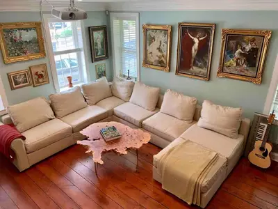 a living room with a couch and a table at Unique Luxury Central Historic Landmark Home in Lambertville