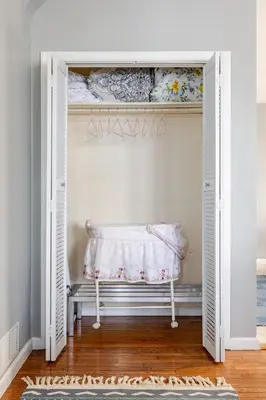 a white closet with a bench in a room at Free Parking -5 Guests- 30 min to NYC in Bayonne