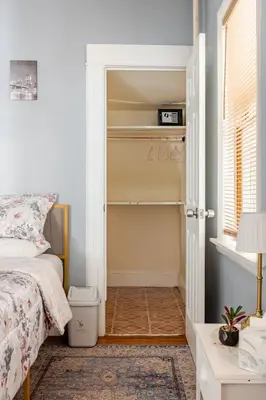 a bedroom with a bed and a closet at Free Parking -5 Guests- 30 min to NYC in Bayonne