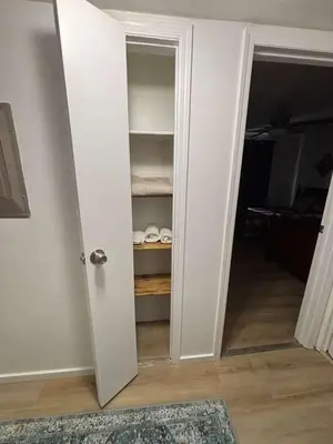 an open door to a room with a closet at Entire Cozy Apartment Fully Renovated Modern Style in North Brunswick