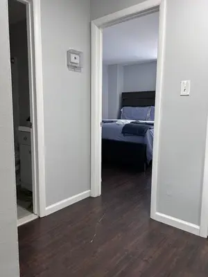 a bedroom with a bed in the middle of a room at Kickback and relax in Elizabeth