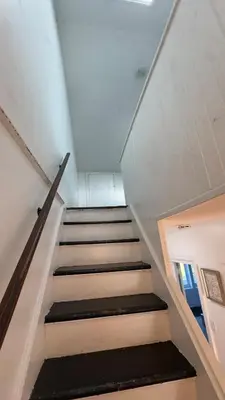 a staircase in a building with a stair case at Bright & Spacious Home close to NYC and World Cup in Bayonne