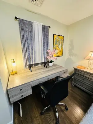 a desk in a room with a chair and a deskictericter at The Princeton Three Cozy 3BR Retreat, BBQ Patio - Shared Home in Trenton