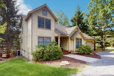 a house with a porch and a driveway at Vista at Camelback Mountain in Tannersville