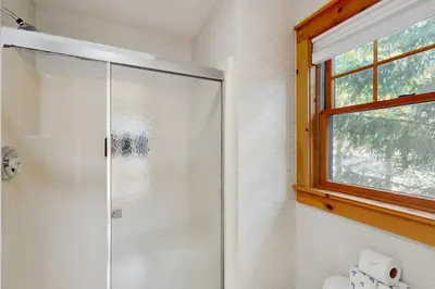 a shower with a glass door in a bathroom at Vista at Camelback Mountain in Tannersville