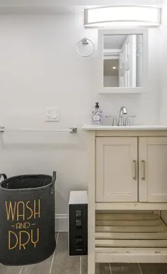 a kitchen with a sink and a trash can at 20 Mins to Times Sq. EWR | Cozy Apartment | Sleeps 4 in Jersey City