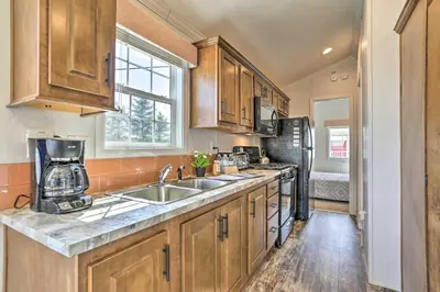 a kitchen with a sink and a refrigerator at Country Escape Close to Ski Resort in Pleasant Mount