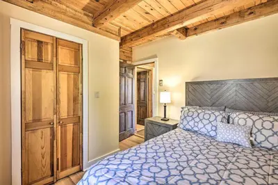 a bedroom with a bed and a wooden ceiling at Gather, Celebrate, Unwind Close to Ski Trails in Pleasant Mount
