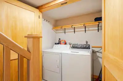 a small laundry room with a washer and dryer at Ski-InandSki-Out Camelback Mtn Retreat with Hot Tub in Tannersville