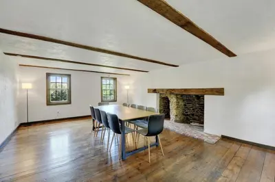 a dining room with a table and chairs at Spacious 5-Bed Retreat in Charming Kennett Square in Kennett Square