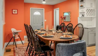 a dining room with a wooden table and chairs at Sleeps 13 Private Sauna Hot Tub Game Room in Thornhurst