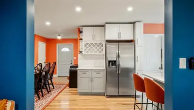 a kitchen with white cabinets and a stainless steel refrigerator at Sleeps 13 Private Sauna Hot Tub Game Room in Thornhurst