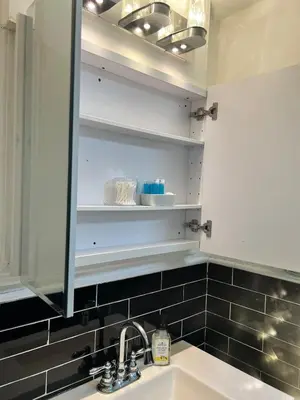 a bathroom with a sink and a mirror at New 3 BR Apt in Elizabeth Railroad Style Path Train Bus Hospital EWR Airport NJ Manhattan NYC in Elizabeth