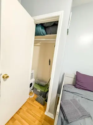 a small bedroom with a bed and a closet at New 3 BR Apt in Elizabeth Railroad Style Path Train Bus Hospital EWR Airport NJ Manhattan NYC in Elizabeth