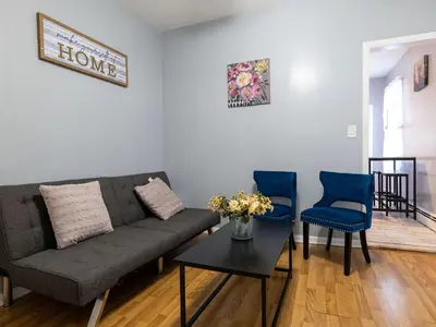 a living room with a couch and two blue chairs at New 3 BR Apt in Elizabeth Railroad Style Path Train Bus Hospital EWR Airport NJ Manhattan NYC in Elizabeth