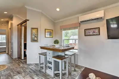 a home bar with stools in a room at Countryside Retreat Close to Ski Slopes in Pleasant Mount