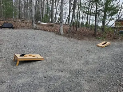 two wooden pallets on the ground in the woods at Mountain Bliss Cottage