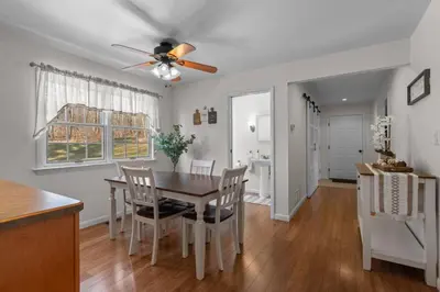 a kitchen and dining room with a table and chairs at Peaceful Valley Retreat in Elliottsburg