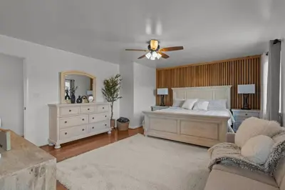 a bedroom with a bed and a ceiling fan at Peaceful Valley Retreat in Elliottsburg