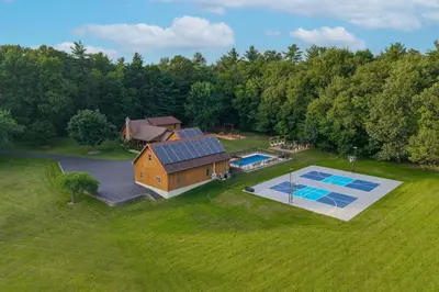 an overhead view of a home with a pool and a house at Ridgetop Cabin in Elliottsburg