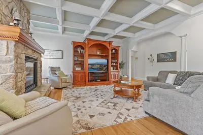 a living room with two couches and a fireplace at Willow Brook Mansion in Millerstown