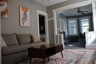 a living room with a couch and a coffee table at Cozy Home, 19m to NYC, 10m to American Dream in Wallington