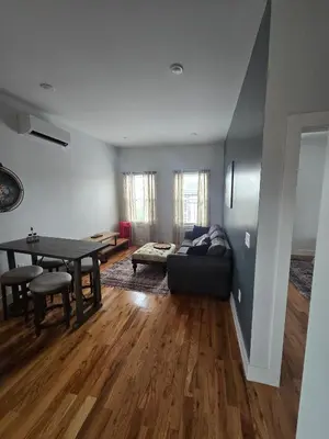 a living room with a couch and a table at The Harrison in Harrison