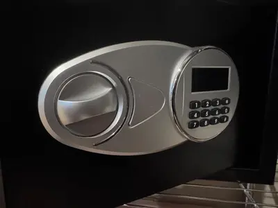a close up of a door knob with a remote control at New York City views! in Kearny