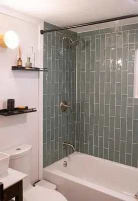 a bathroom with a shower with a tub and a toilet at Hot Tub, Wood-burning Fireplace and 4 acres of Forest in Margaretville in Margaretville