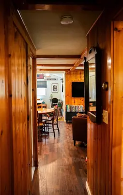 a dining room and kitchen with a table and chairs at Hot Tub, Wood-burning Fireplace and 4 acres of Forest in Margaretville in Margaretville